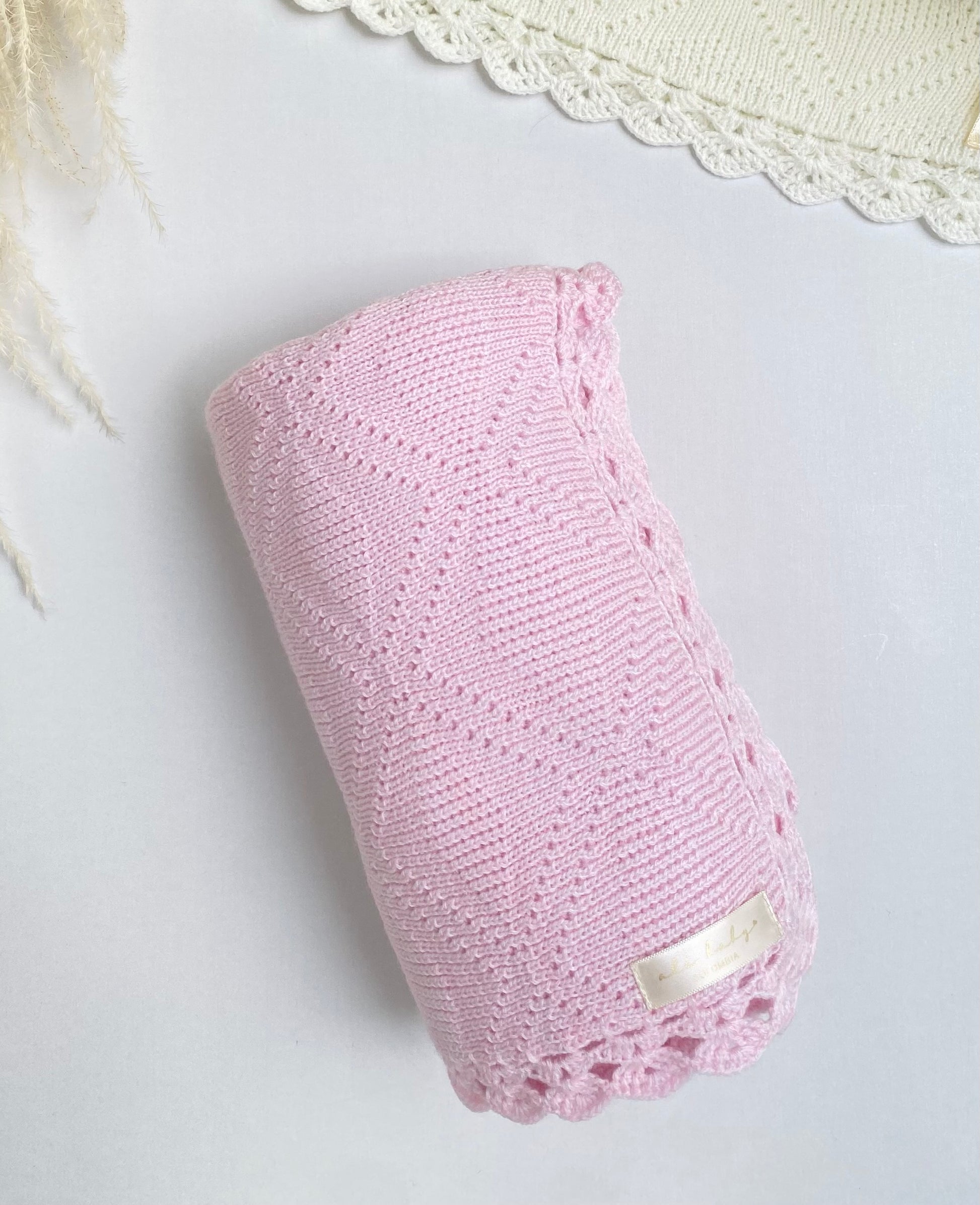 Manta tejida rosado